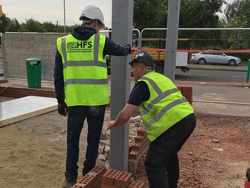 HFS members of staff carrying out an onsite installation which required structual steelwork to be erected for taunton dean services