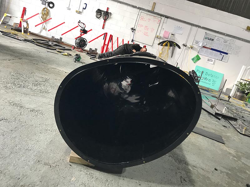 HFS Plastic work showcasing a HDPE length of pipe being made in the shape of an egg