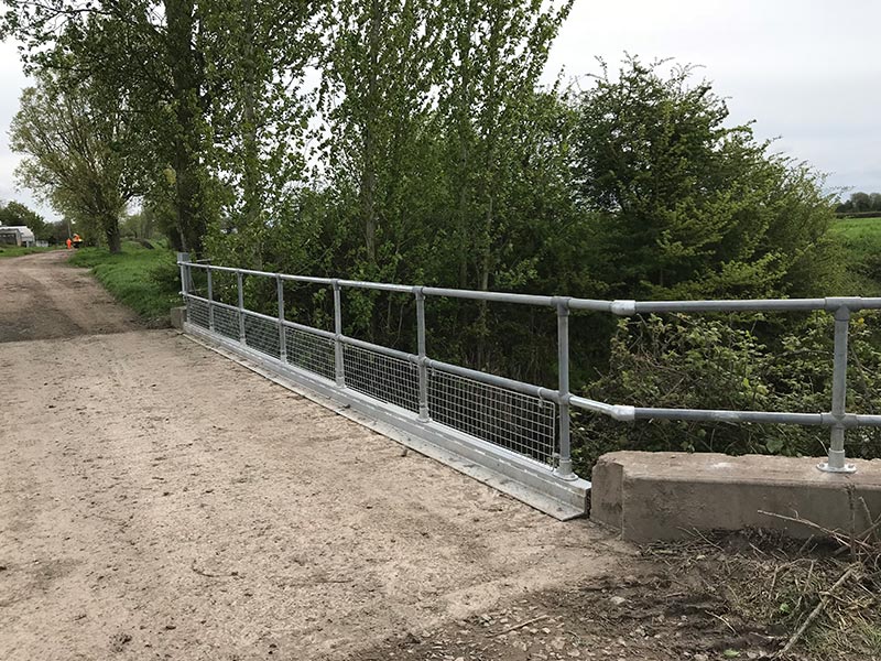 HFS carrying out a site service to repair a bridge by strengthening  and replacing railings