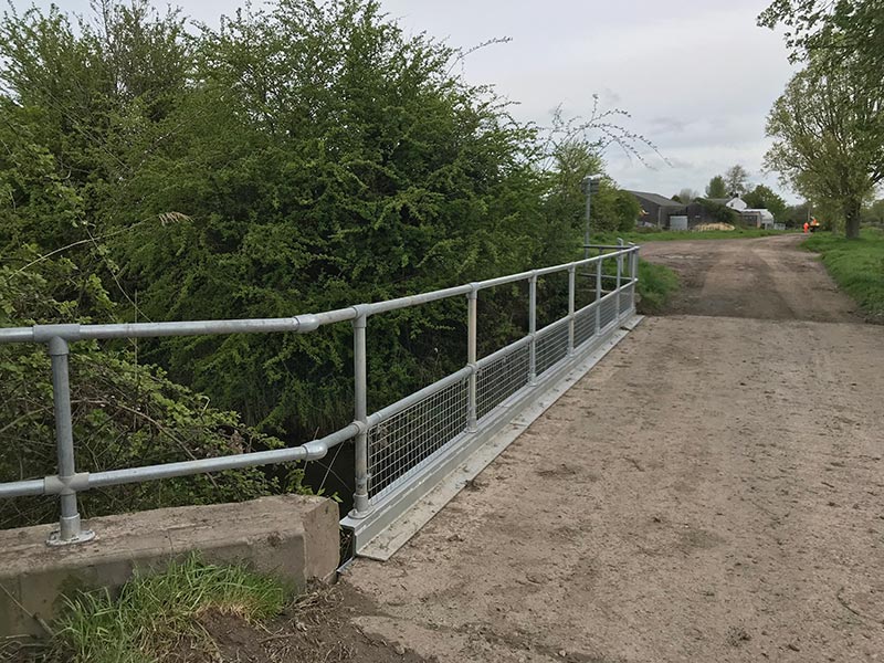 HFS carrying out a site service to repair a bridge by strengthening  and replacing railings